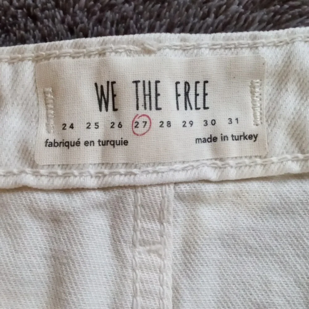We the Free 27 waist cream colored five pocket distressed miniskirt